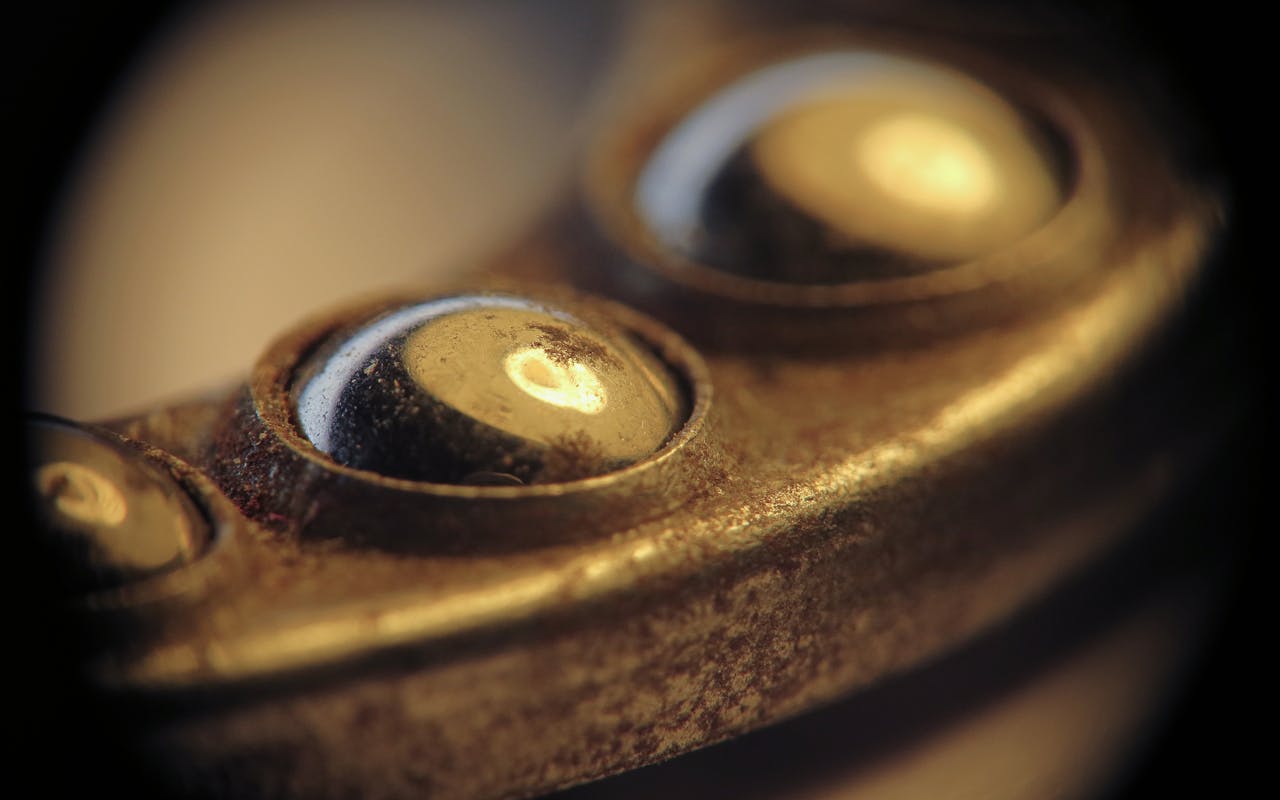 About Close-up macro view of metal ball bearings showcasing industrial texture and detail.